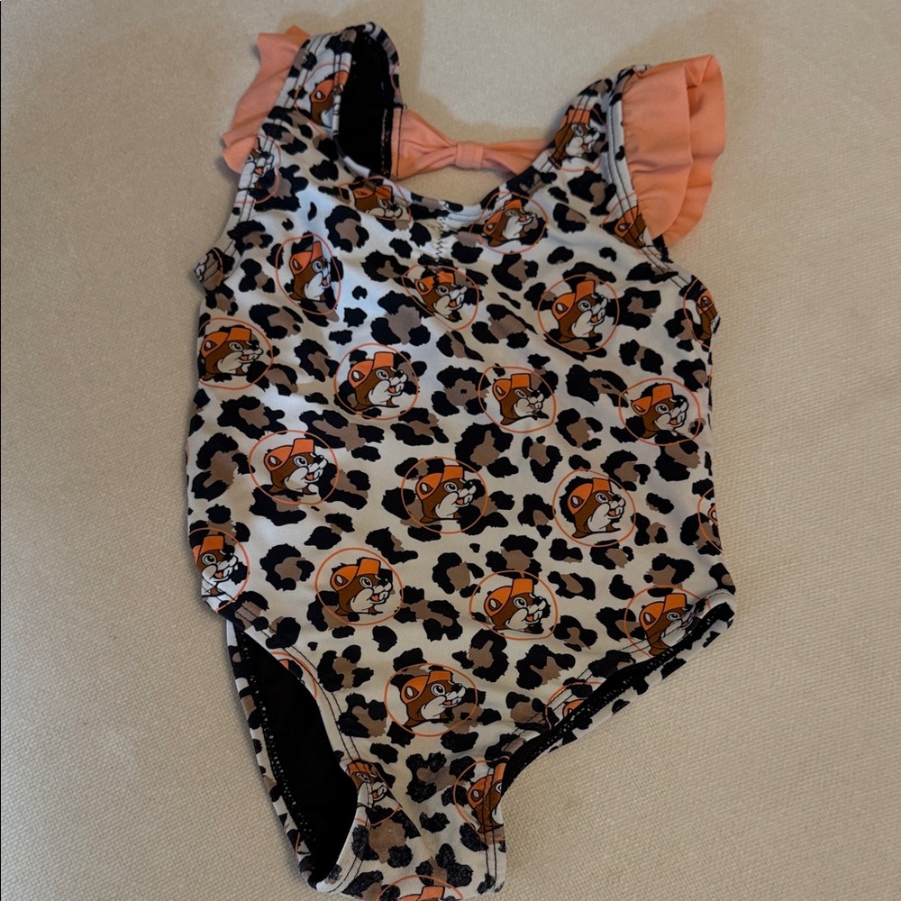 Bucees Leopard Print Baby Swimsuit with Orange Accents and Bow detail